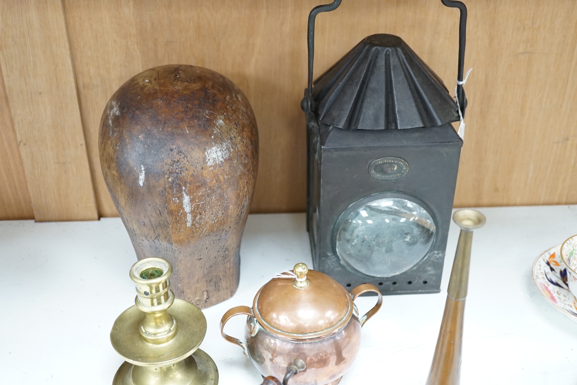 A Toleware lantern, a hatter's block, a copper jelly mould, a slug iron and three other items, tallest 34cm (7). Condition - fair to good